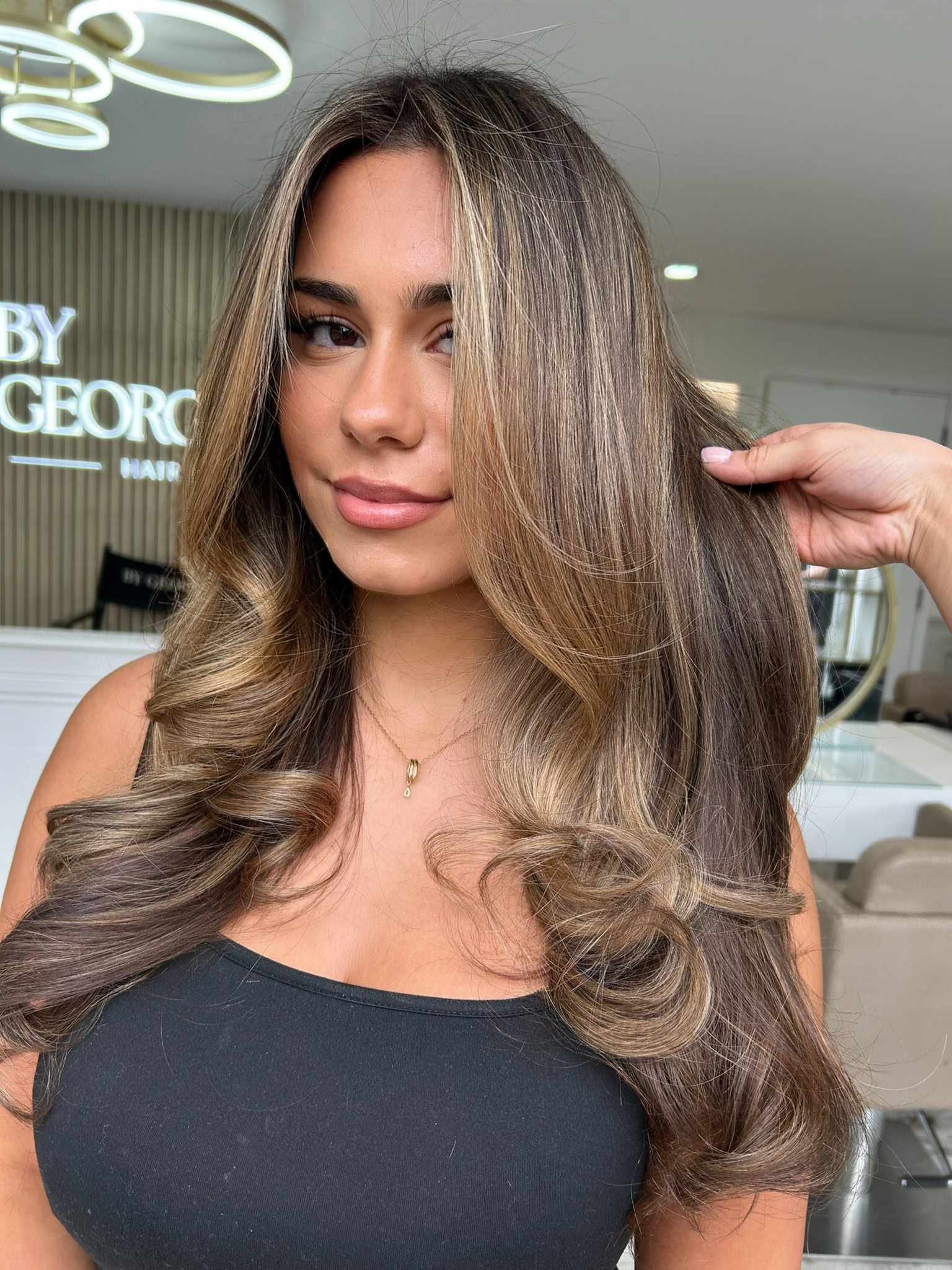 Dimensional brunette balayage with bouncy waves