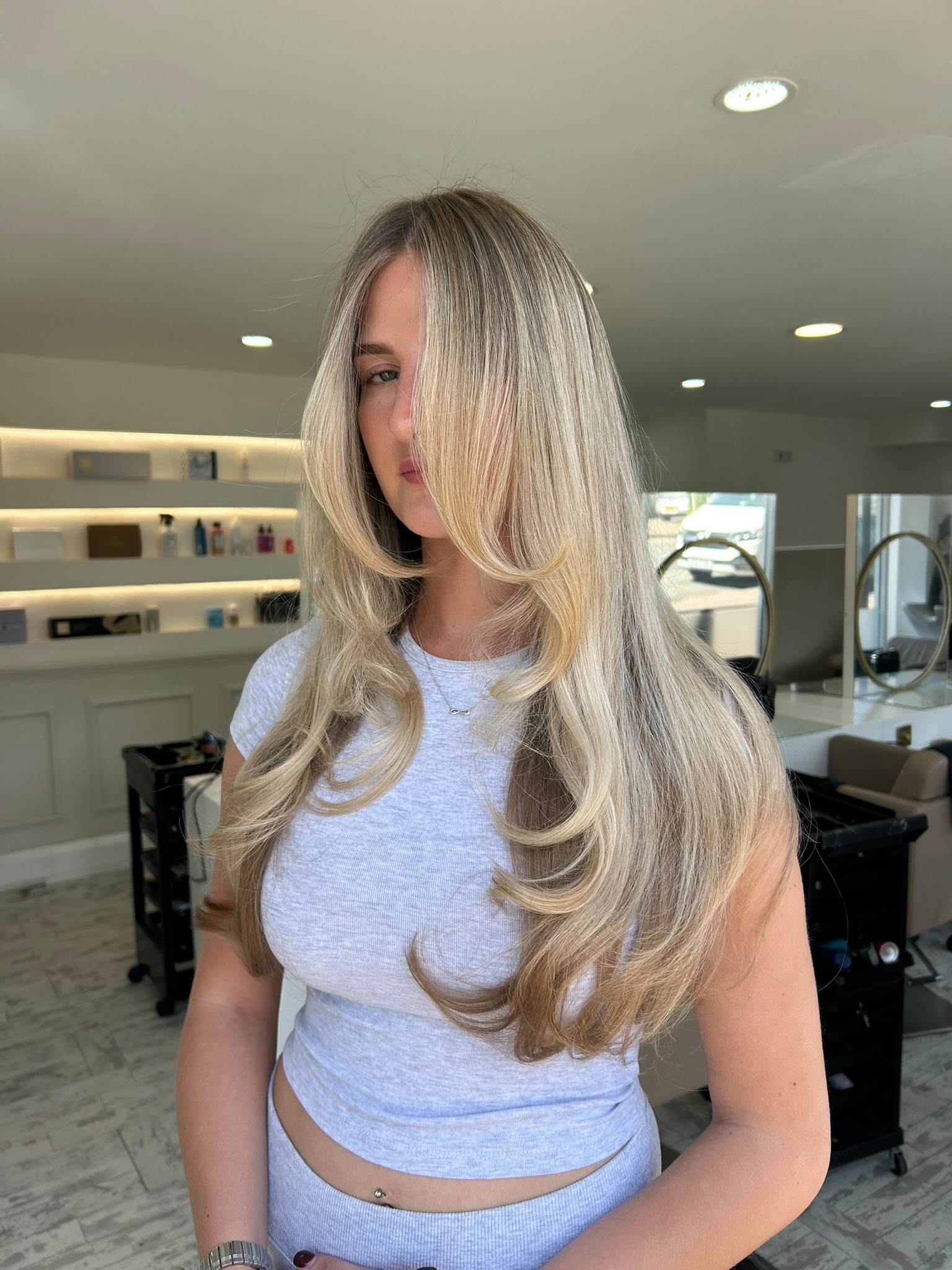 Bright blonde balayage with long layered styling
