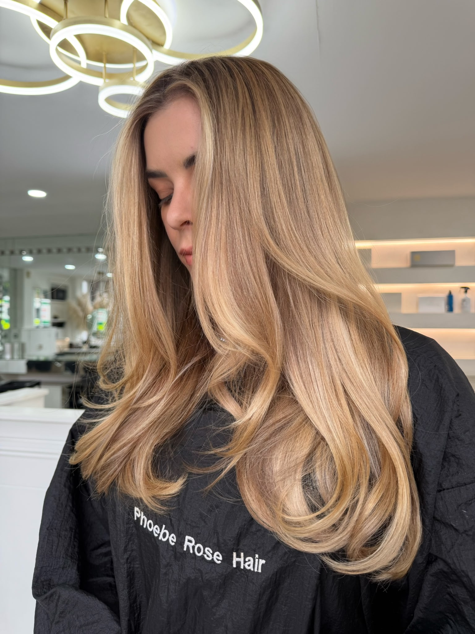 Honey blonde balayage with smooth layered movement