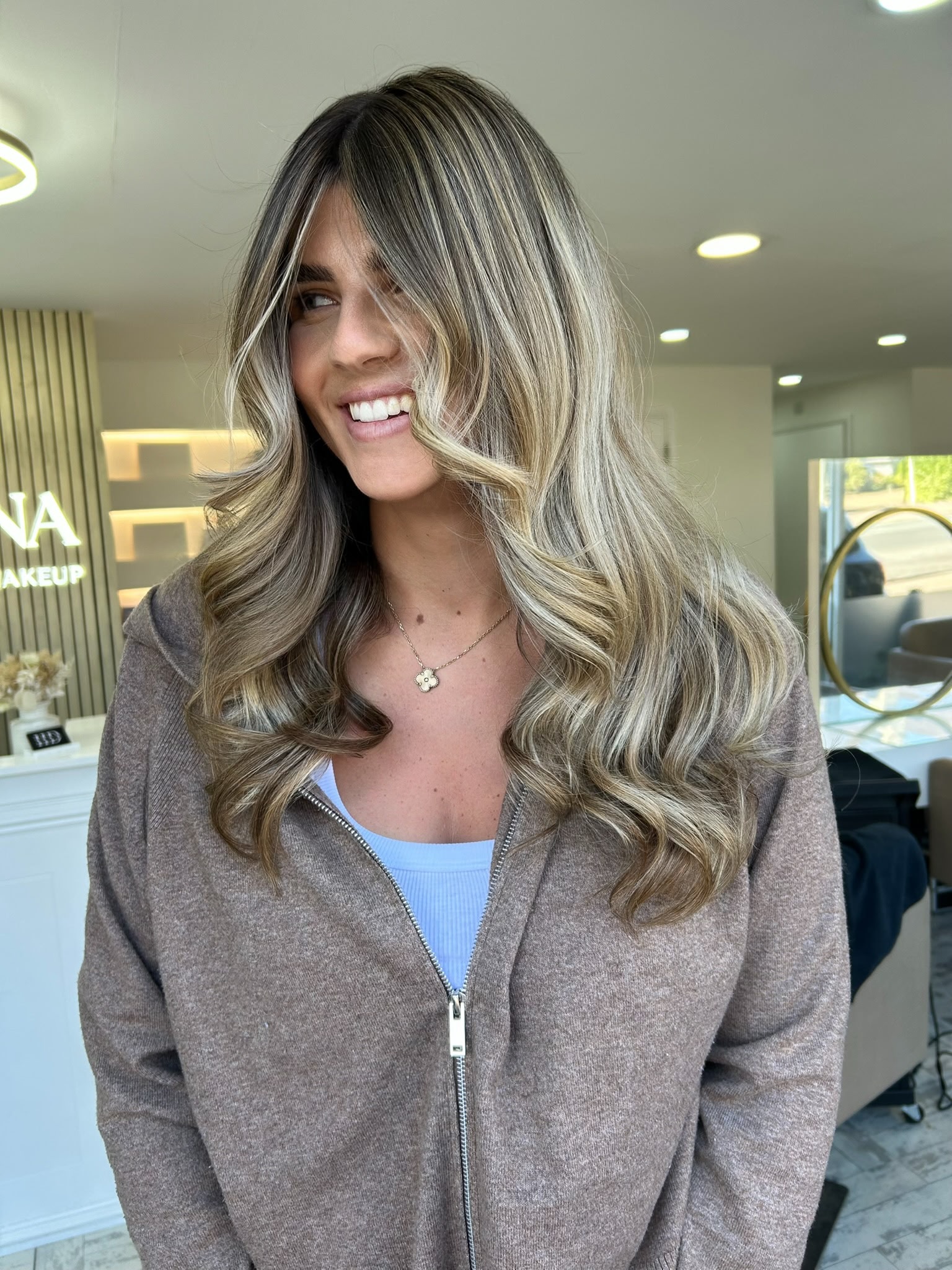 Soft dimensional balayage with face framing ribbons