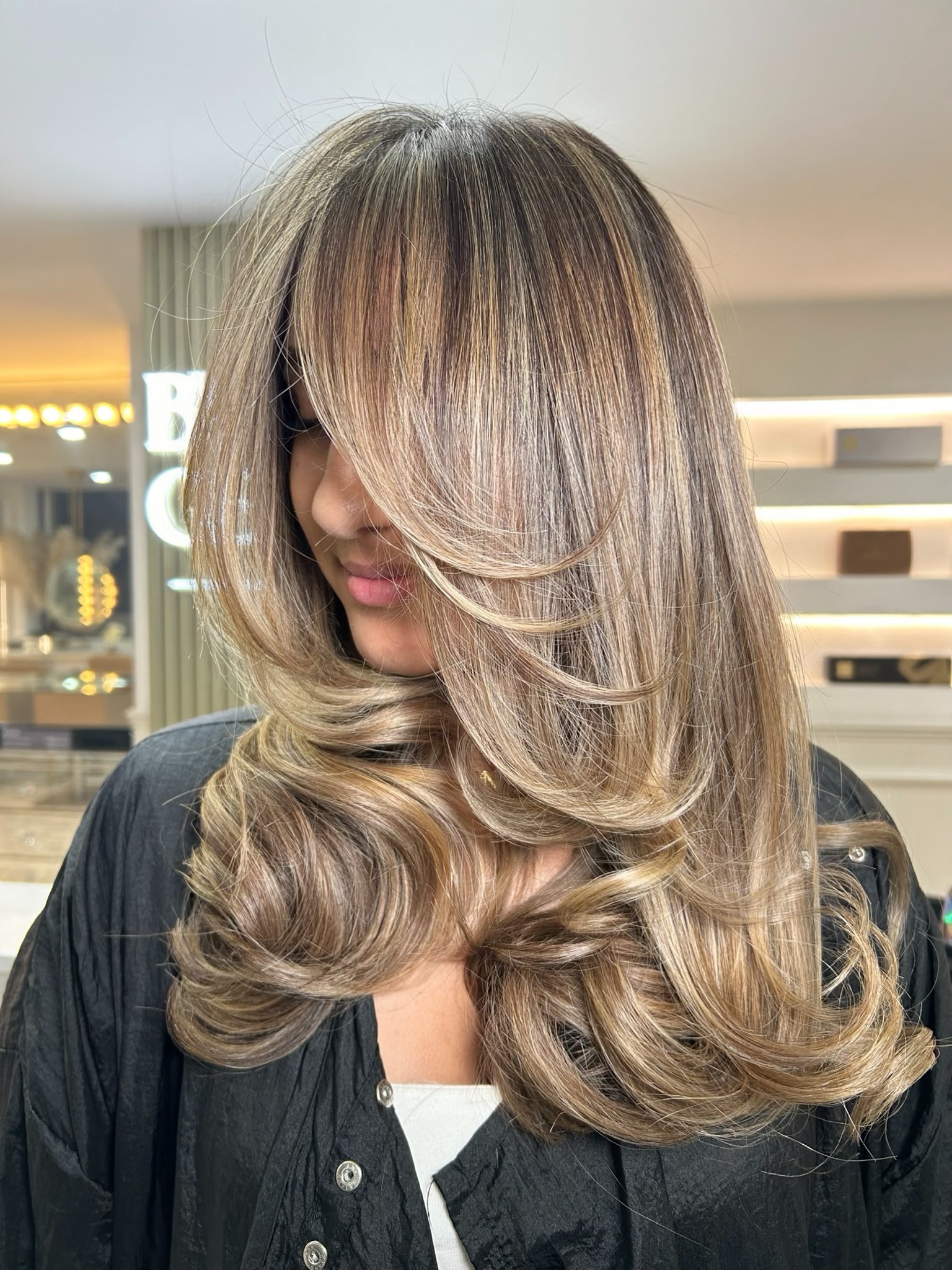 Lived-in blonde colour with soft curled ends