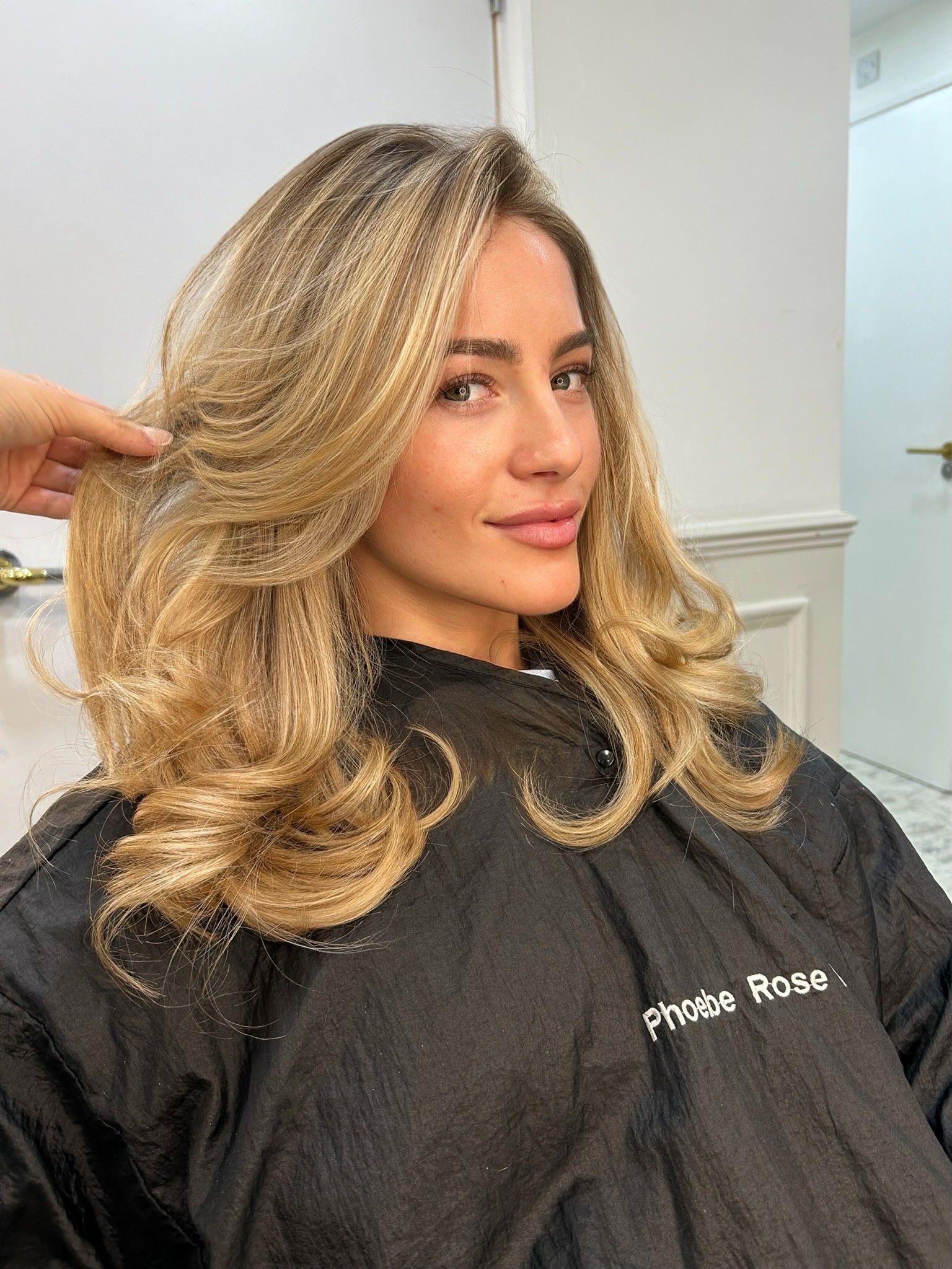 Golden blonde balayage with voluminous waves